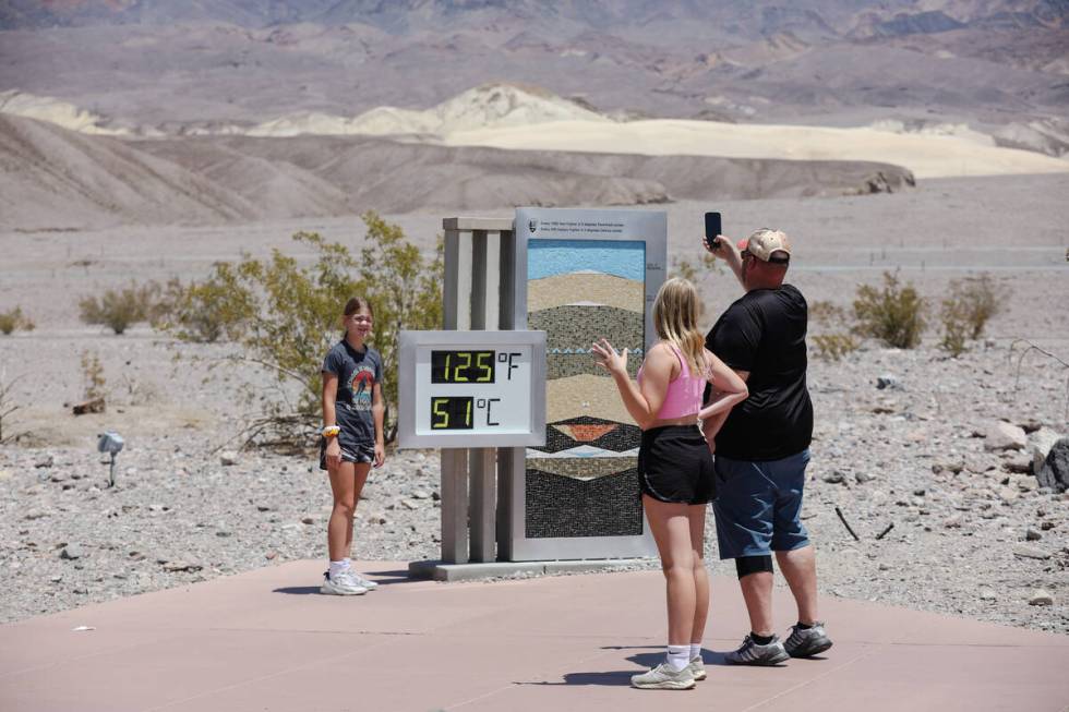 Cory Svobodny, of Minnesota, next to his daughter Sophie Svobodny, 11, takes a photo of his dau ...