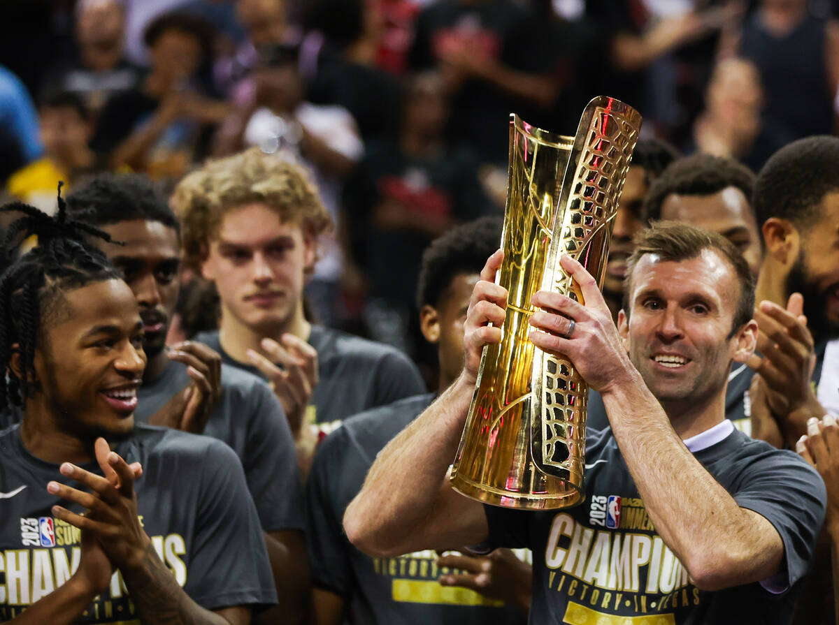 Mike Gerrity, Cleveland Cavalier’s head coach for the summer league season, lifts up the ...