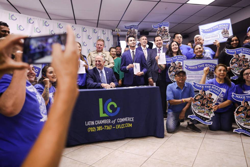 Gov. Joe Lombardo smiles amongst supporters of Senate Bill 92, a law that will provide a path t ...