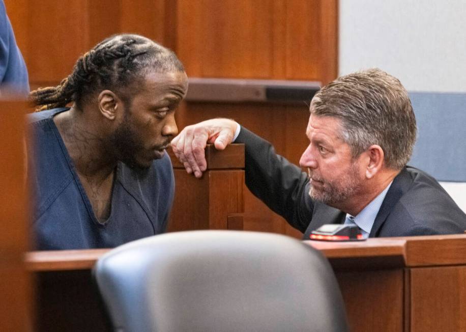 Durwin Allen, left, listens to his attorney Peter Christiansen after his sentencing at the Regi ...