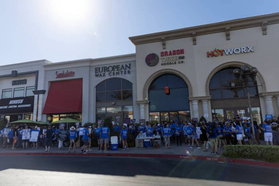 At least 200 educators and members of the Clark County Education Association protest outside Su ...