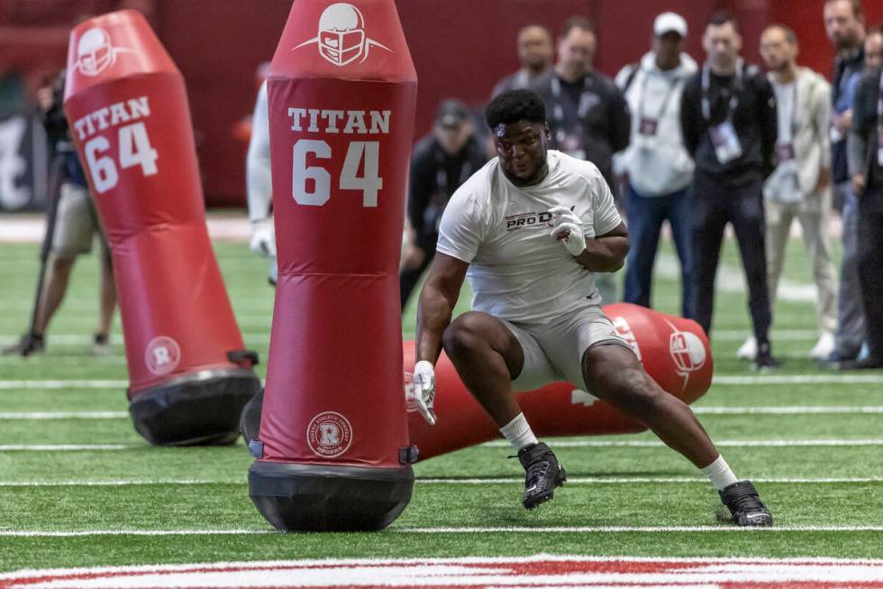 Former Alabama defensive lineman Byron Young works in position drills at Alabama's NFL pro day, ...