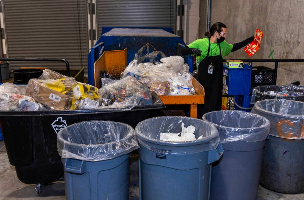 Trash is sorted for recyclables at Allegiant Stadium which contributes to the stadium now LEED ...