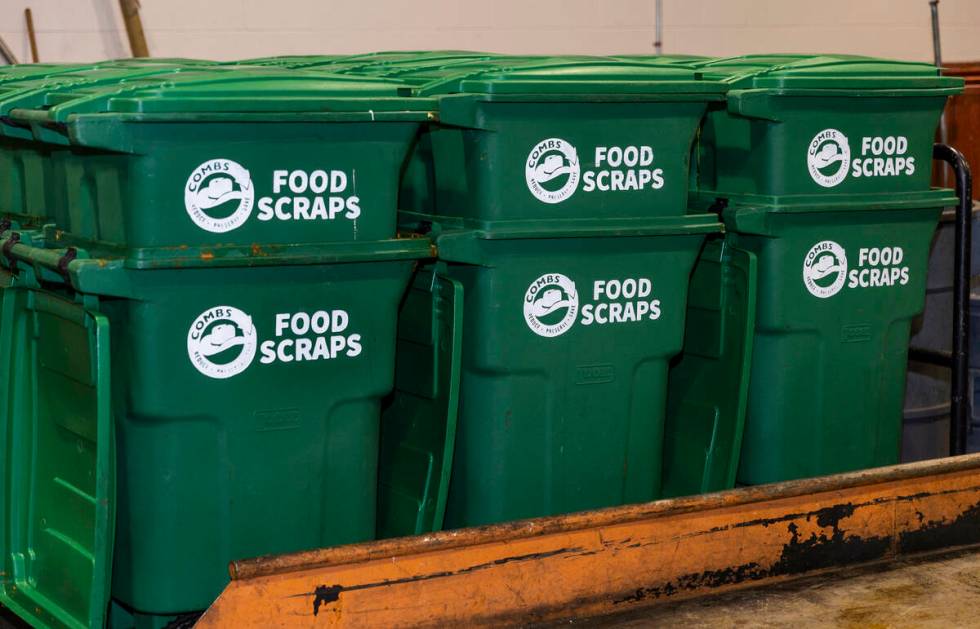 Allegiant Stadium team members collect food scraps which are then provided to a local livestock ...