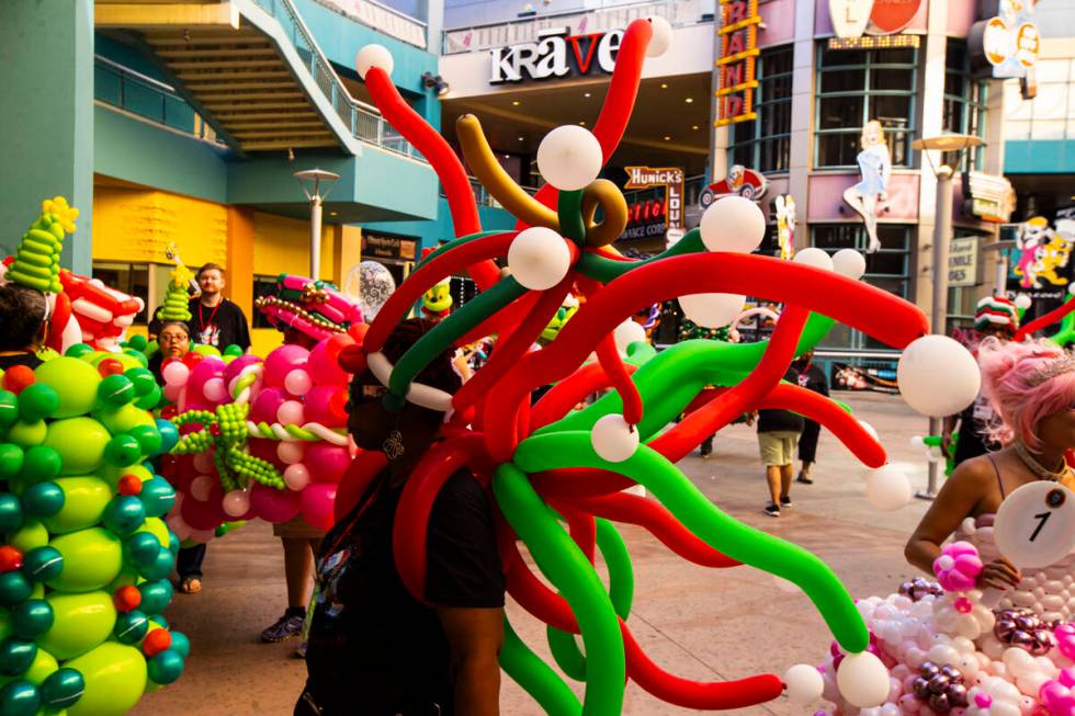 Attendees of the Bling Bling Jam balloon convention take a break at Neonopolis during their par ...