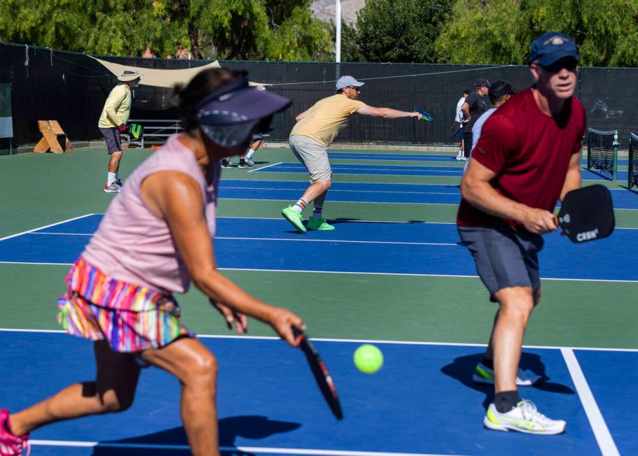 People play pickleball at Durango Hills Park on June 30, 2023, in Las Vegas. (Bizuayehu Tesfaye ...