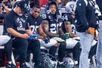 Raiders running back Josh Jacobs (28) sits on the bench during a change of possession against t ...