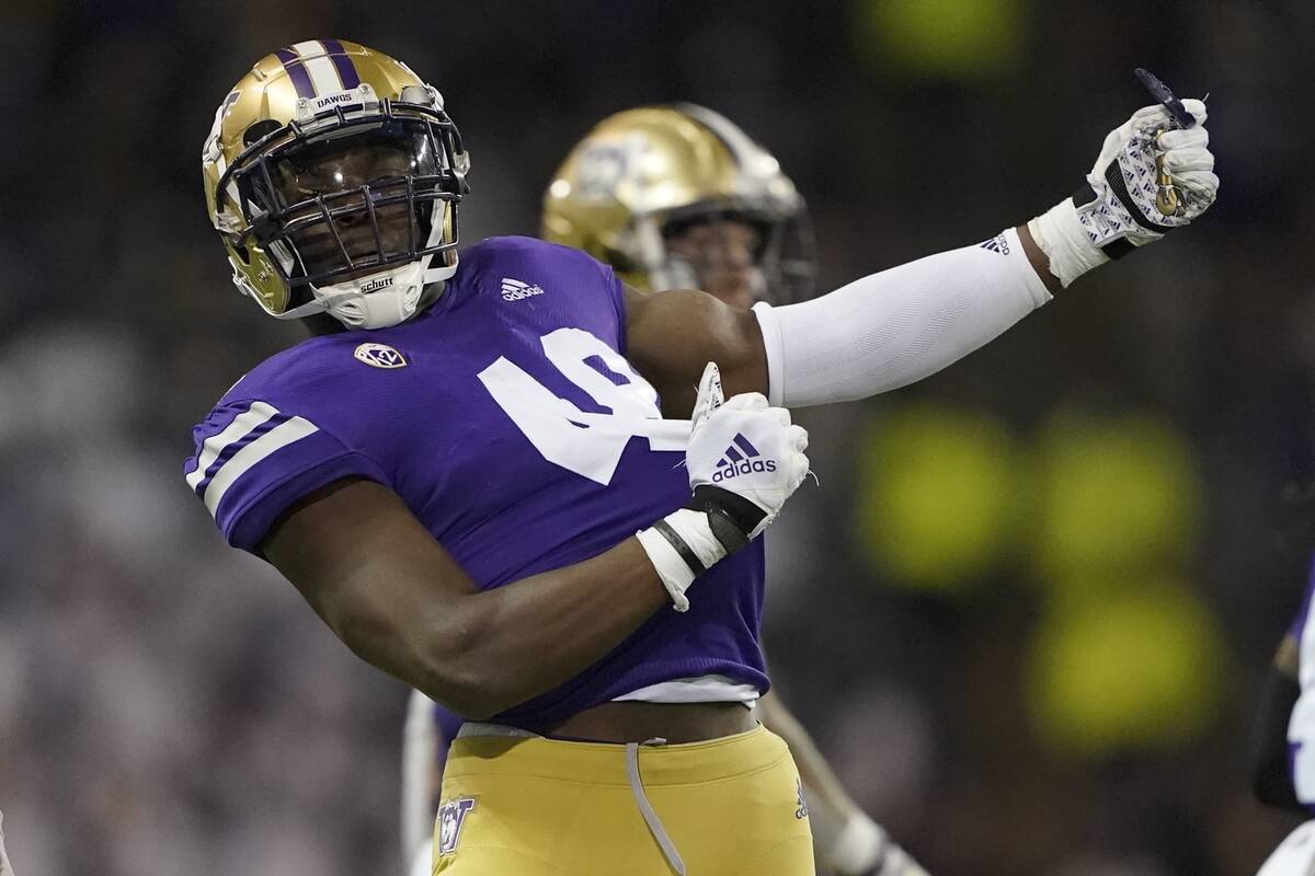 Washington linebacker Edefuan Ulofoshio (48) reacts to a play during the second half of an NCAA ...