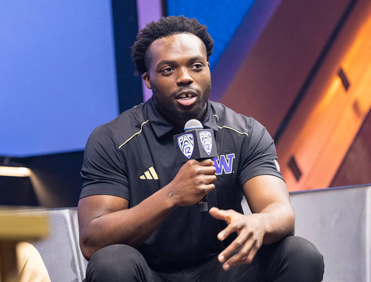 Washington Huskies linebacker Edefuan Ulofoshio speaks during the Pac-12 Football media day at ...