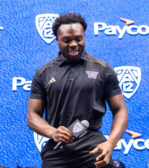 Washington Huskies inebacker Edefuan Ulofoshio leaves the podium after speaking during the Pac- ...