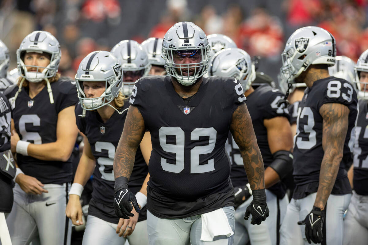 Las Vegas Raiders defensive tackle Neil Farrell, Jr. (92) warms up before playing against the K ...