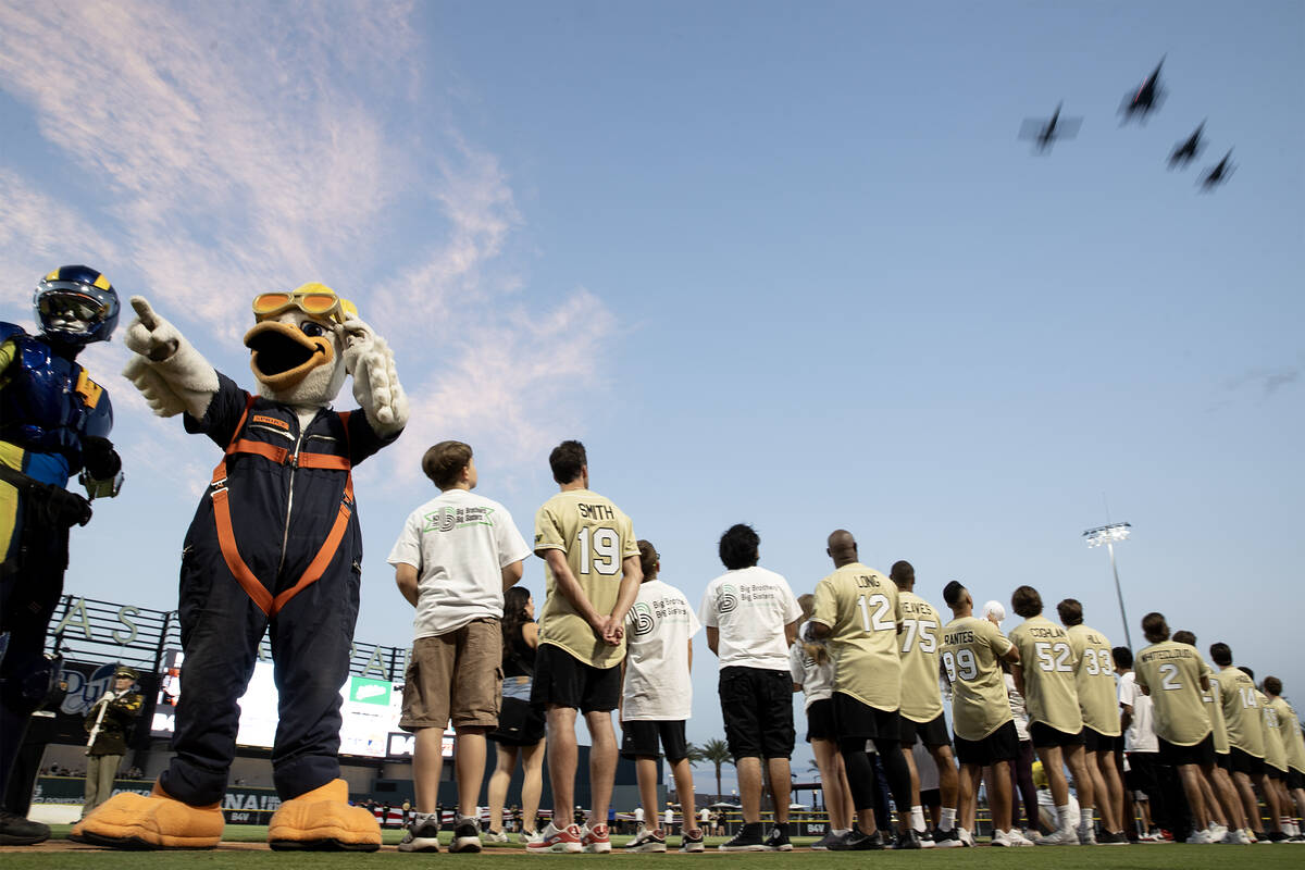 Airforce jets fly over Las Vegas Ballpark during the annual Battle for Vegas charity softball g ...
