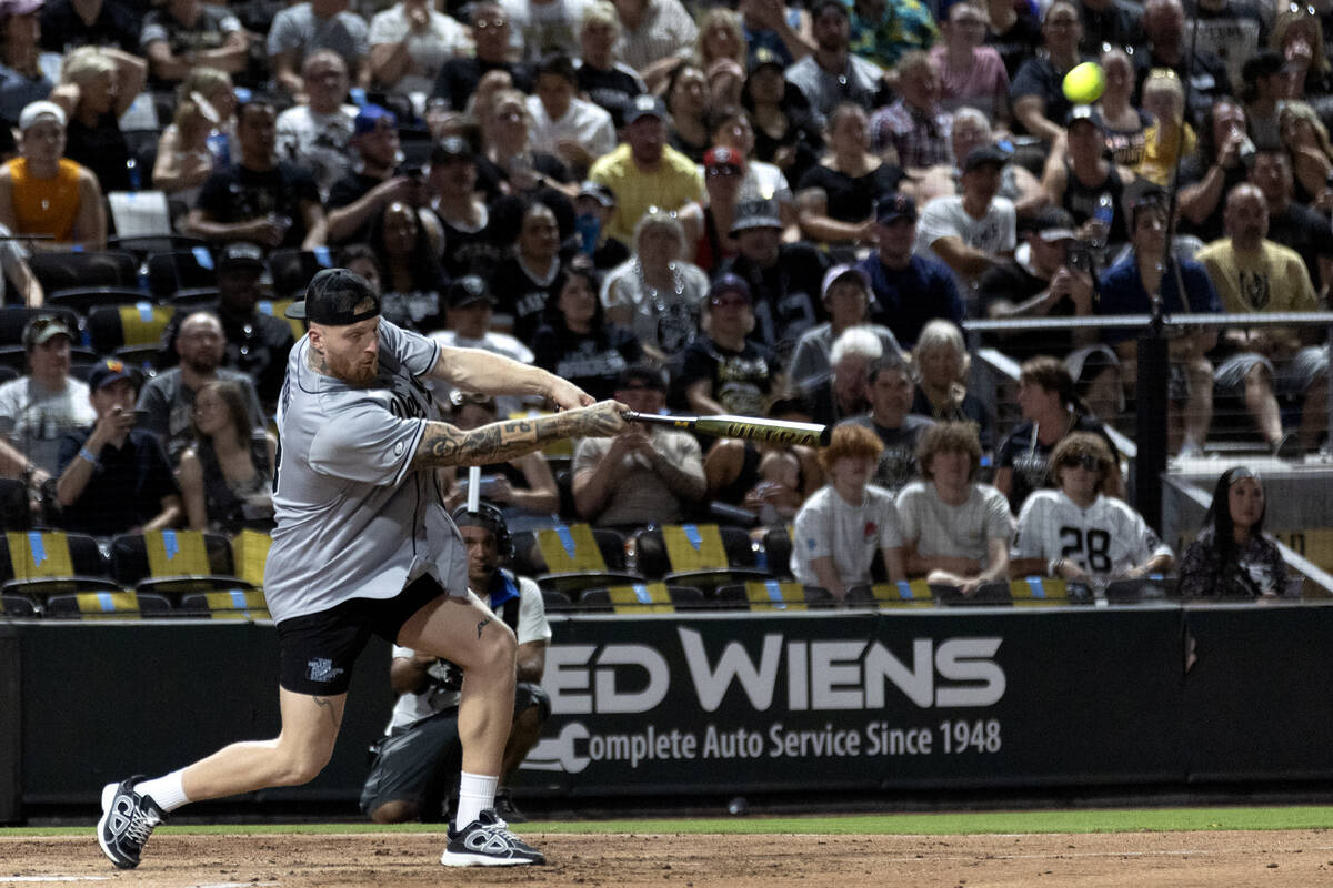Raiders defensive end Maxx Crosby bats against the Golden Knights during the annual Battle for ...