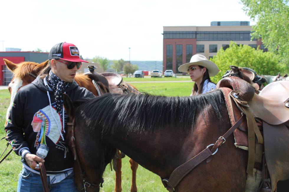 Two people take part in a protest against MHA Nation tribal leadership, as the tribe's energy b ...