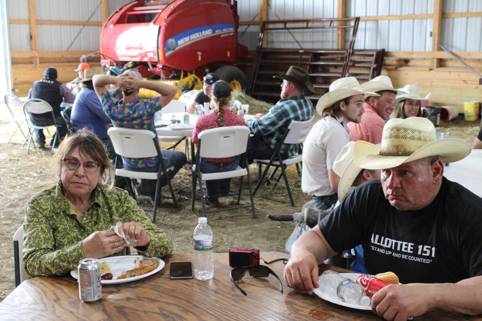 Husband and wife Todd Hall, right, and Patti Jo Hall have lunch on their ranch after branding c ...