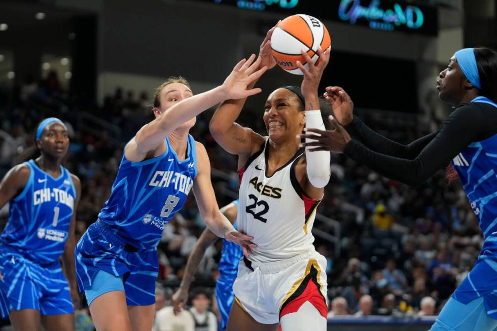 Chicago Sky forward Alanna Smith, left, knocks the ball out of the hands of Las Vegas Aces forw ...