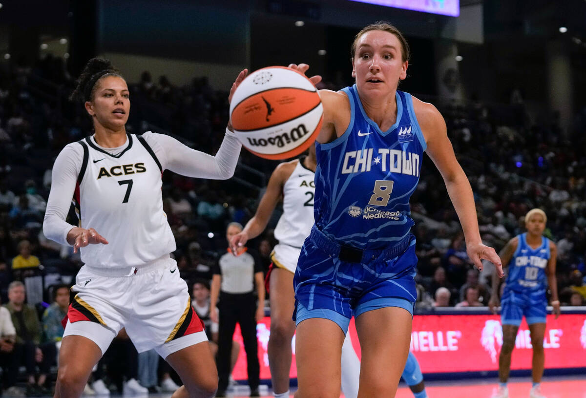 Chicago Sky forward Alanna Smith reaches for the ball, next to Las Vegas Aces' Alysha Clark dur ...