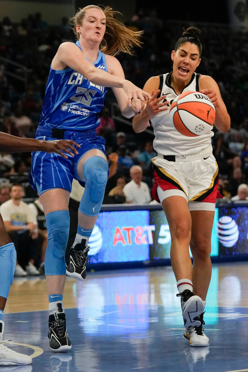 Chicago Sky forward Morgan Bertsch, left, and Las Vegas Aces guard Kelsey Plum vie for control ...