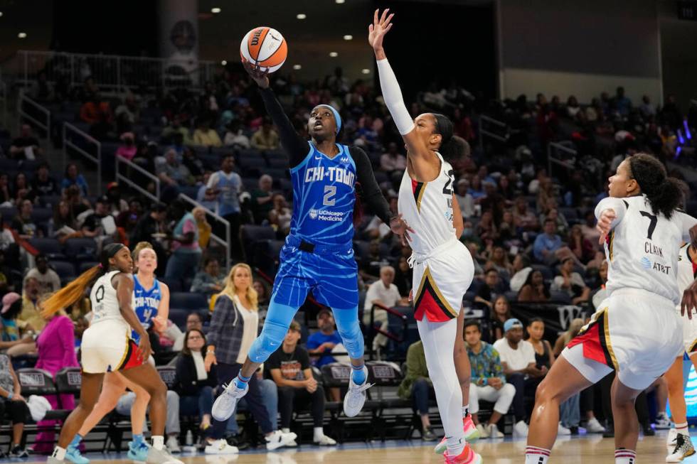 Chicago Sky guard Kahleah Copper shoots next to Las Vegas Aces forward A'ja Wilson, right, duri ...