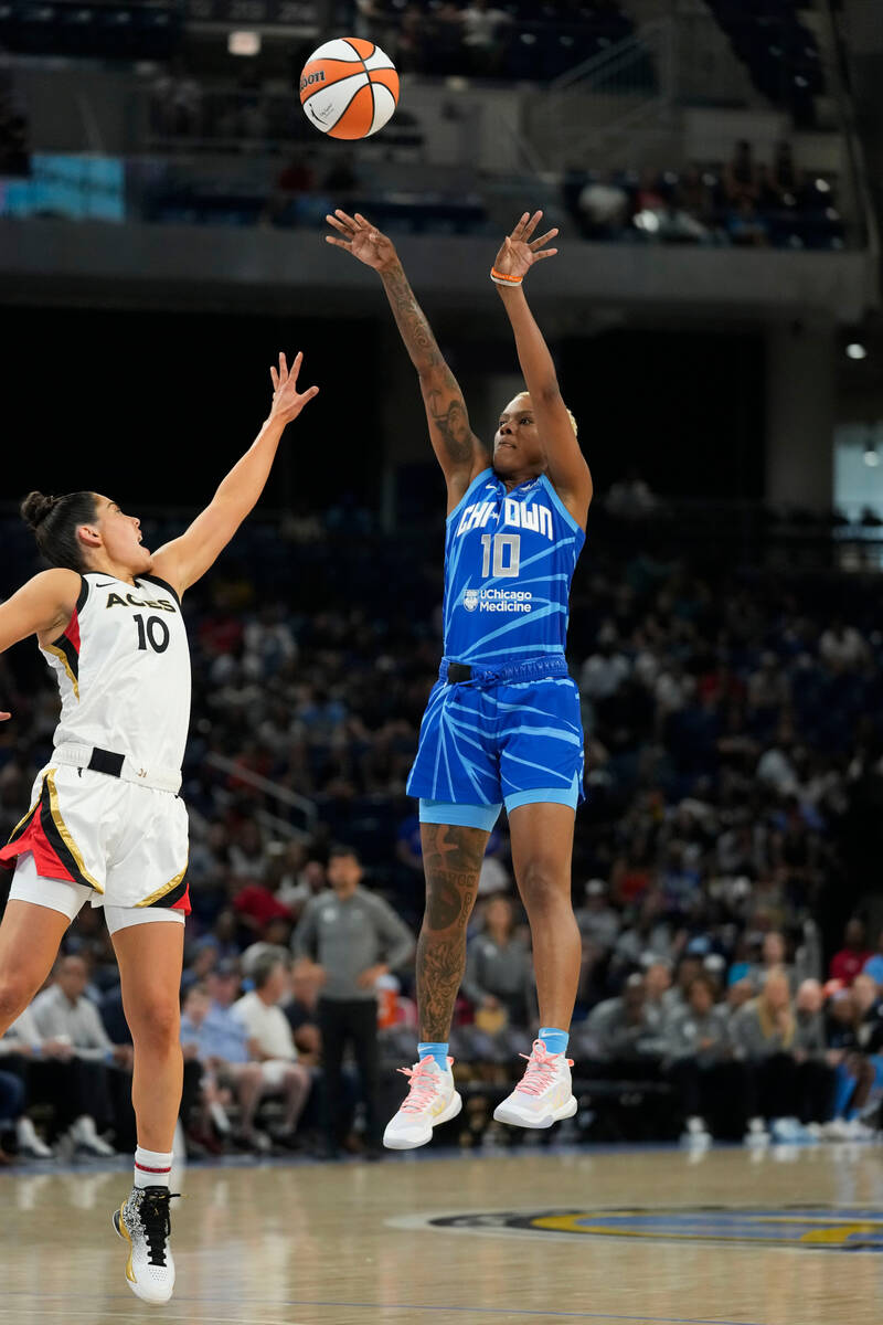 Chicago Sky guard Courtney Williams shoots over Las Vegas Aces guard Kelsey Plum during the fir ...