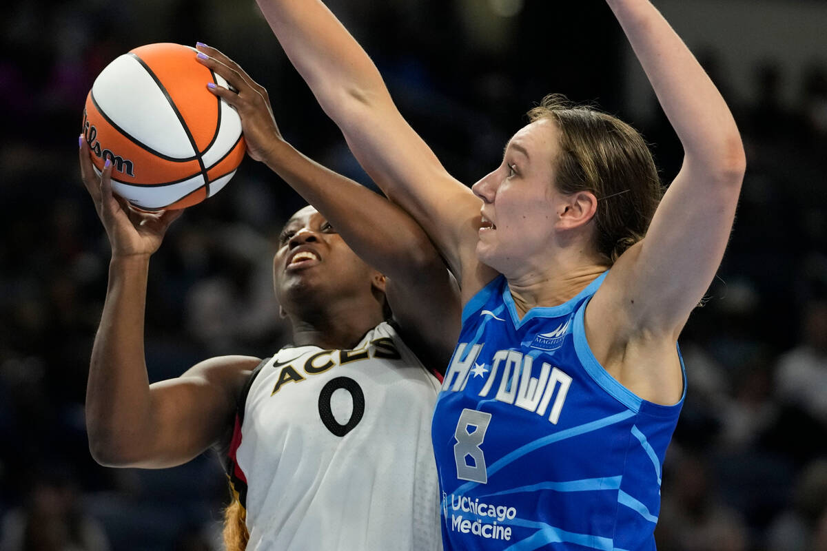 Chicago Sky forward Alanna Smith, right, defends against a shot by Las Vegas Aces guard Jackie ...