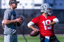 Raiders quarterback Jimmy Garoppolo (10) sets up to pass during training camp at the Intermount ...