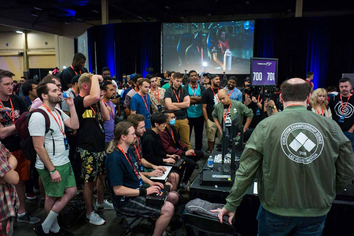 Attendees watch competitors play "Tekken 7" during the preliminary rounds of the Evolution Cham ...