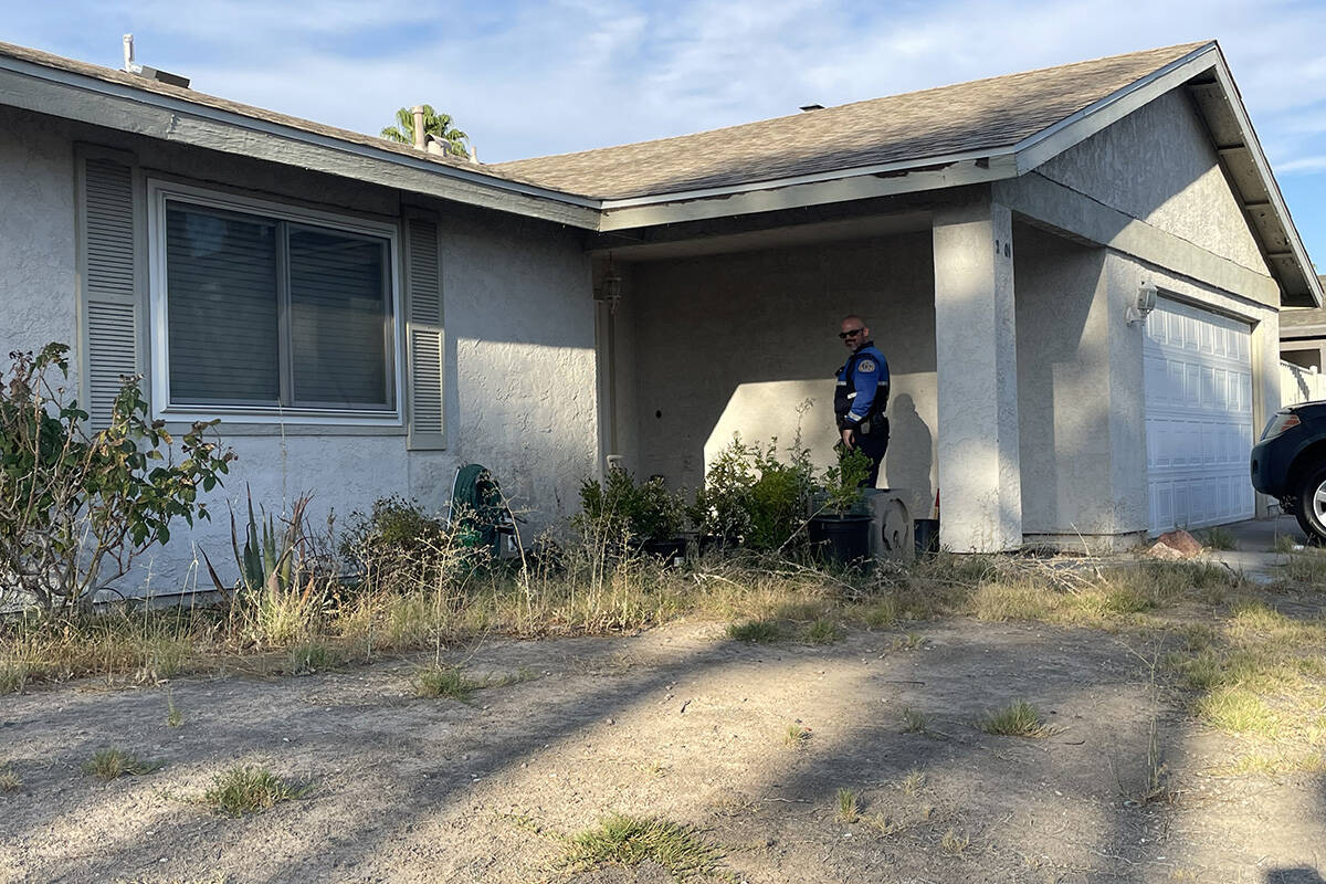 A police officer visits a house on Malboro and Valle Verde drives to inquire about camera foota ...