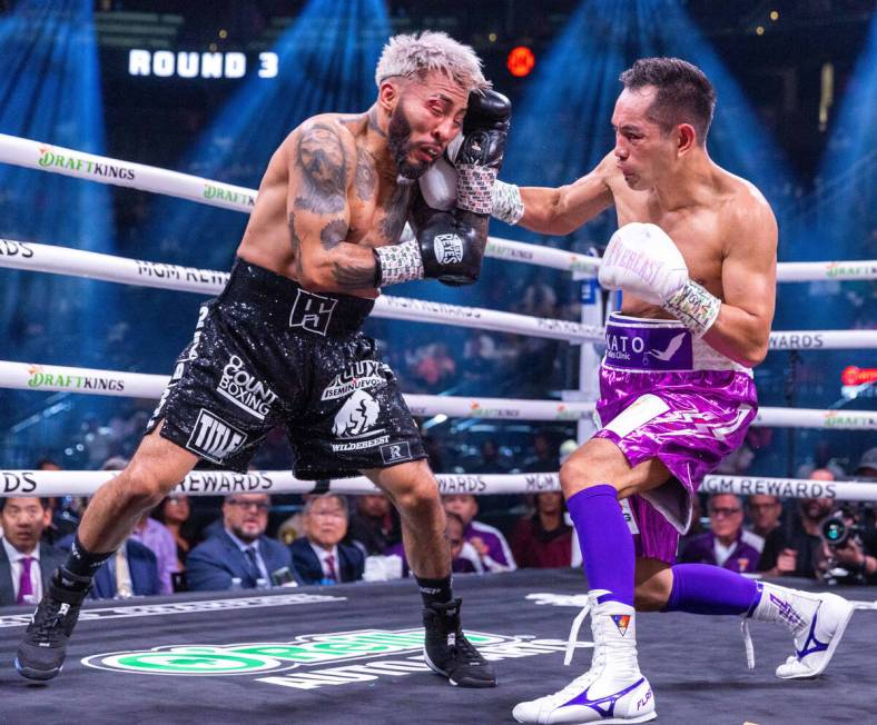 Alexandro Santiago takes a shot on the chin by Nonito Donaire in round 3 during a WBC world ban ...