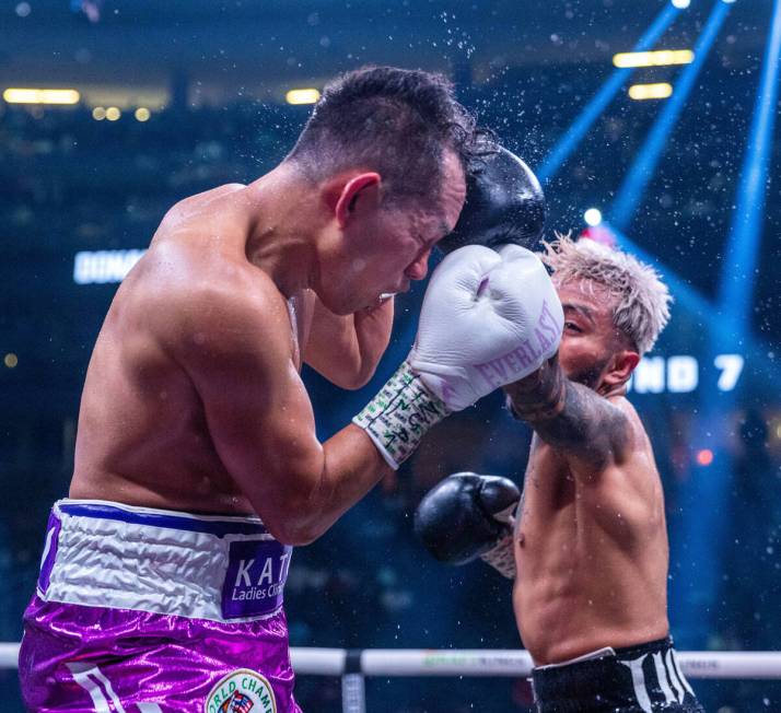 Nonito Donaire takes a punch to the head by Alexandro Santiago in round 7 during a WBC world ba ...