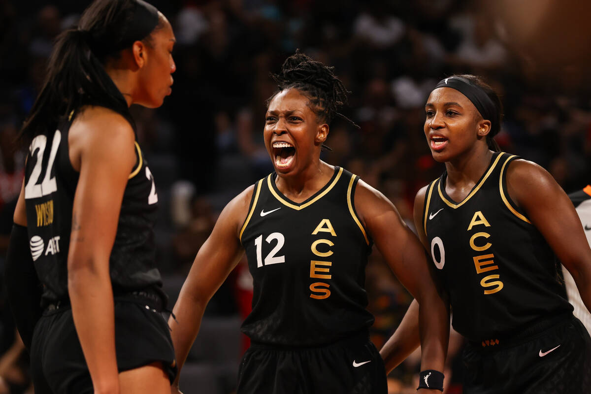 Las Vegas Aces guard Chelsea Gray (12) and Las Vegas Aces guard Jackie Young (0) hype up Las Ve ...