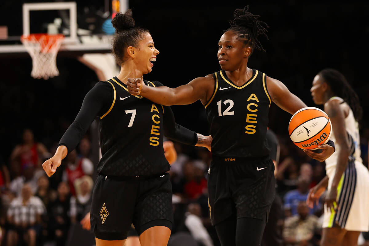 Las Vegas Aces forward Alysha Clark (7) hypes up Las Vegas Aces guard Chelsea Gray (12) after s ...