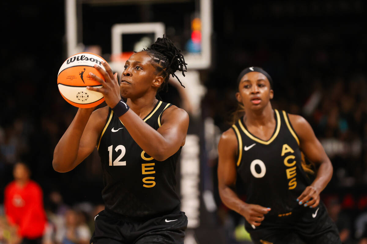 Las Vegas Aces guard Chelsea Gray (12) prepares to take a shot during a WNBA basketball game ag ...