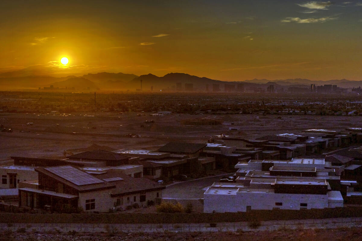 The sun rises over the valley on Thursday, July 20, 2023, in Las Vegas. This July will go down ...