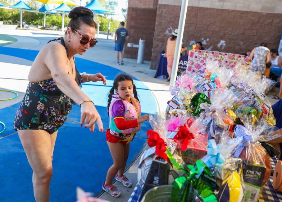 Jodi Achberger shows Emelina Achberger all of the different back to school supplies that she ca ...