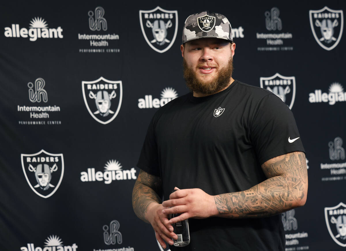 Raiders center Andre James leaves the podium after addressing the media at the Intermountain He ...