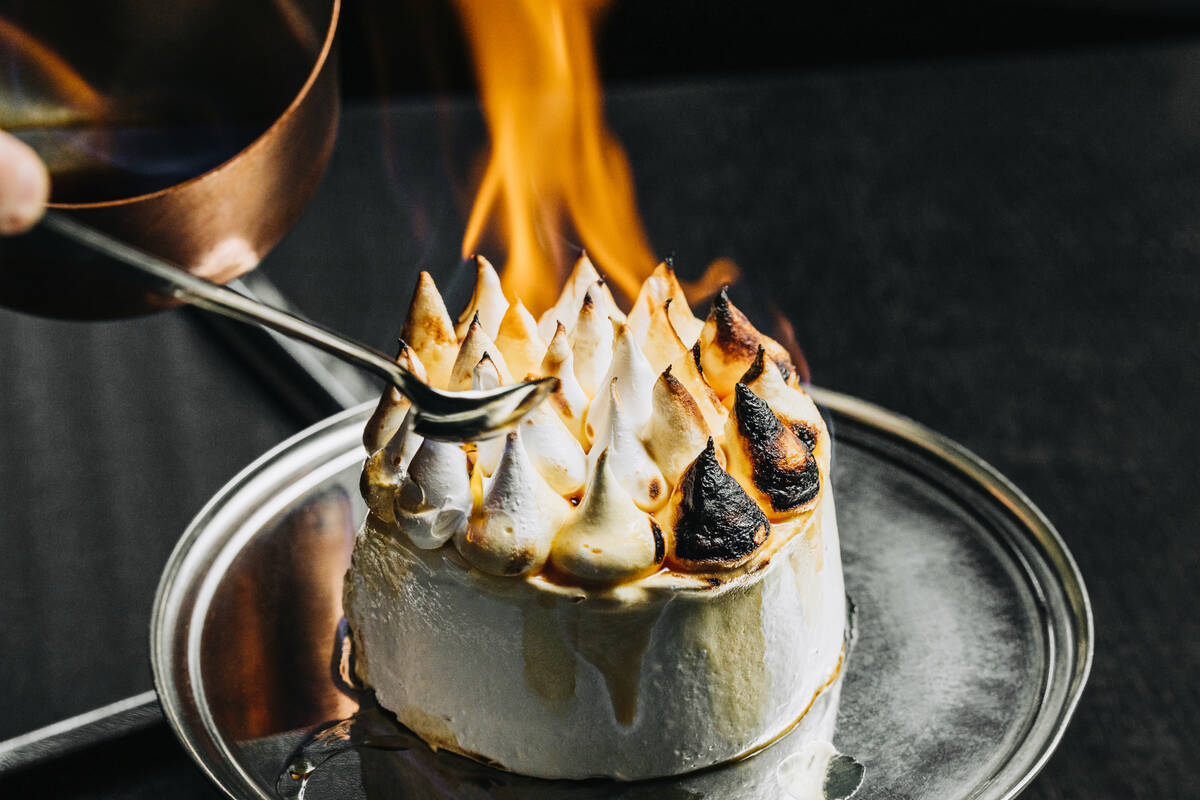 A Torta Merengata, a take on baked Alaska, is flambéed tableside at RPM Italian in The Forum S ...
