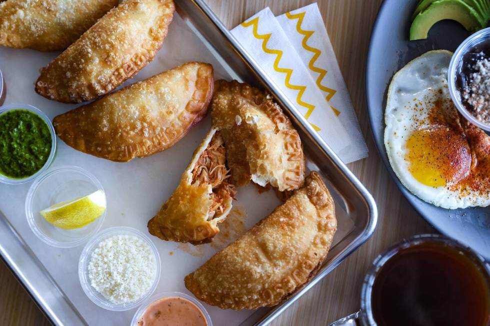 A flight of beef, chicken, queso, shrimp and spicy mushroom empanadas at Makers & Finders in He ...