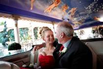 Louise Adams Behling, left, and Peter Behling of Sault Ste. Marie, Michigan, cuddle in the back ...