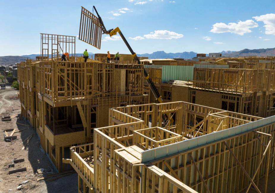 File Last year construction workers help build a new Summerlin neighborhood. Las Vegas-based Ho ...