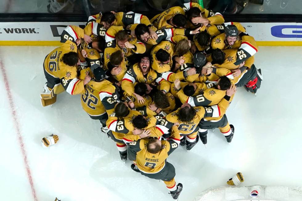 Members of the Vegas Golden Knights celebrate after they defeated the Florida Panthers 9-3 to w ...