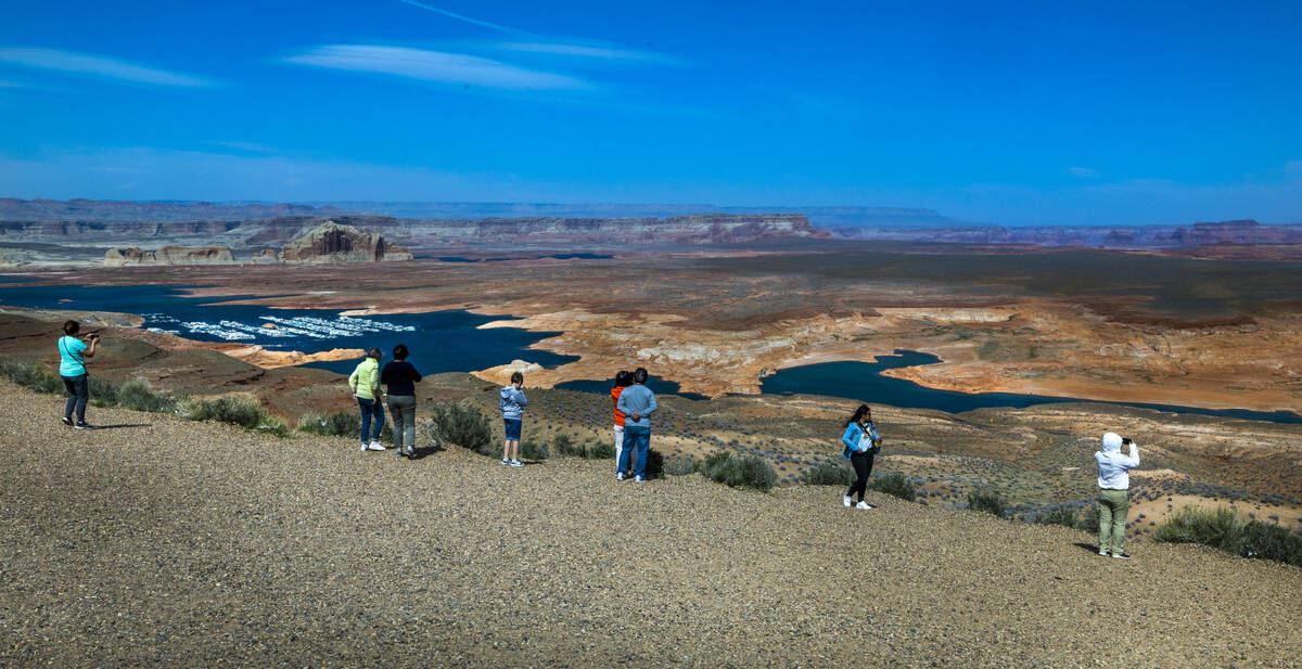 Visitors view the dwindling Lake Powell, fed by the Colorado River, from on high on April 18, 2 ...