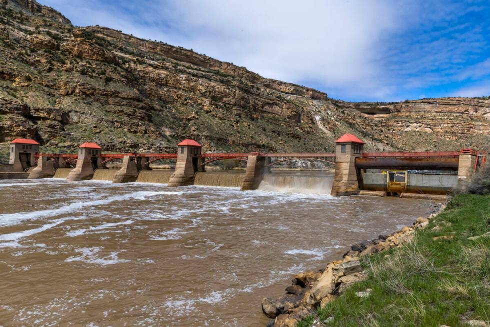 Water flows from the Roller Dam along the Colorado River on April 21, 2023, in Palisade, Colo. ...