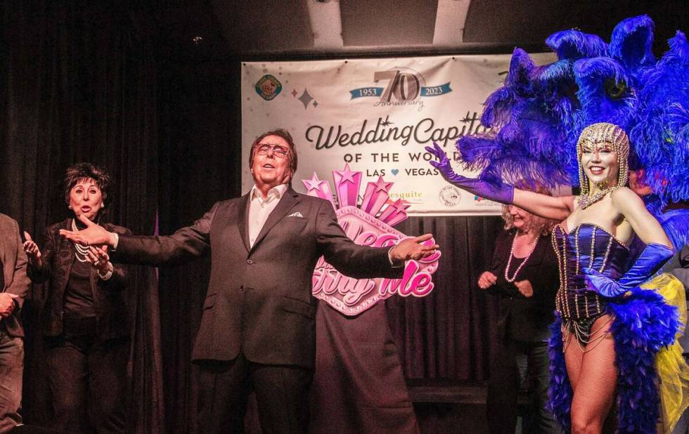 Dennis Bono, middle, at the preview event of the 70th anniversary of Las Vegas being the "Weddi ...