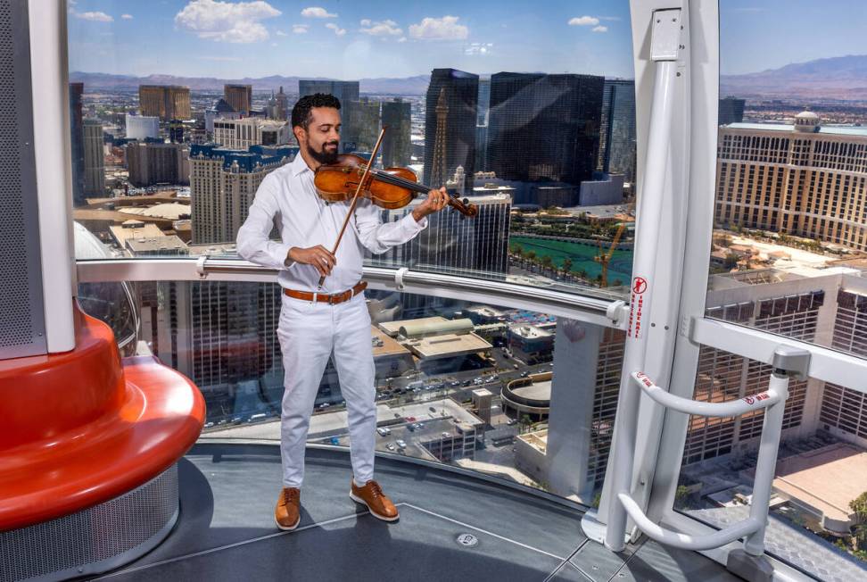 Omar Shelly plays viola with the Las Vegas Philharmonic and enjoys the view while playing on th ...