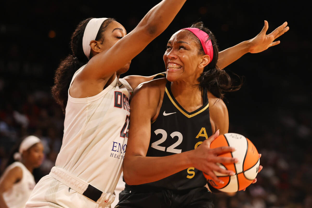 Las Vegas Aces forward A'ja Wilson (22) moves the ball past Atlanta Dream forward Monique Billi ...