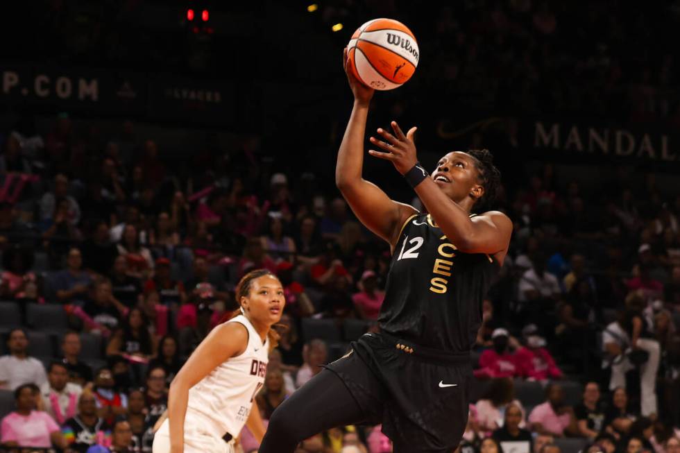 Las Vegas Aces guard Chelsea Gray (12) goes in for a shot during a WNBA basketball game against ...