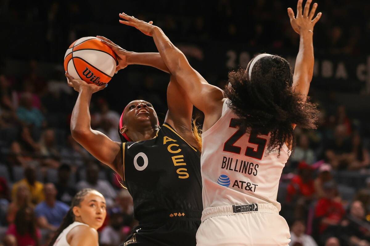 Las Vegas Aces guard Jackie Young (0) takes a shot during a WNBA basketball game against the At ...