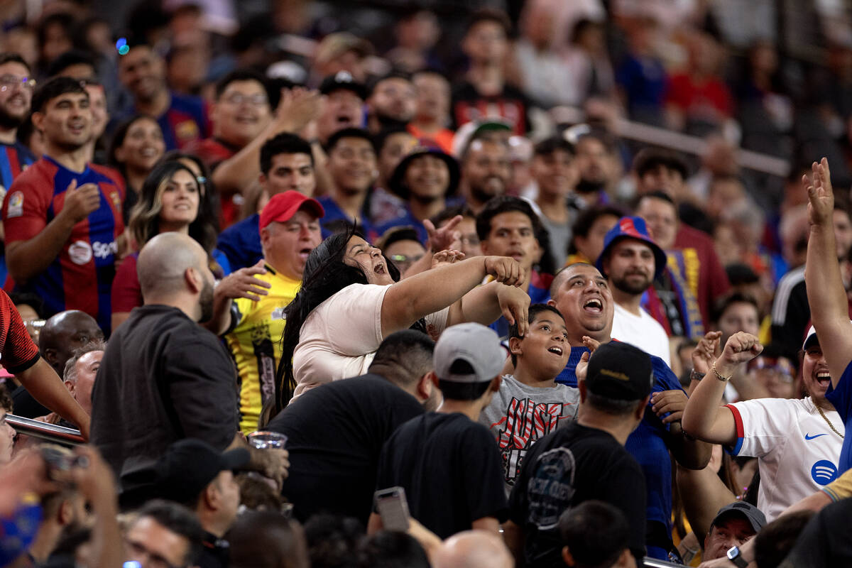 Barcelona fans reject an errant Milan ball during the first half of a Soccer Champions Tour exh ...