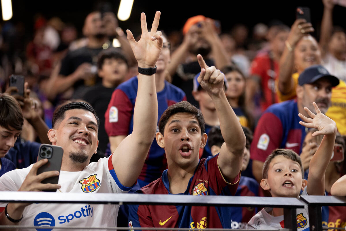 Barcelona fans cheer for players during warmups before a Soccer Champions Tour exhibition match ...